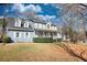 Inviting two-story home showcasing a charming covered front porch, complementing the home's curb appeal, set on a beautifully landscaped lot at 1230 Scenic Brook Sw Trl, Conyers, GA 30094