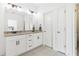 The bathroom features a double vanity with granite countertop and a view to the bedroom at 1904 Glen Ivy # 19, Marietta, GA 30062