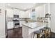 Modern kitchen with stainless steel appliances, white cabinets, and a granite countertop island at 1904 Glen Ivy # 19, Marietta, GA 30062