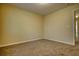 A simple bedroom features neutral carpeting, light yellow walls, and white trim at 8138 Brookbend Dr, Douglasville, GA 30134