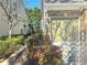 Exterior shot of the garage of a two-story brick home with a small manicured garden at 2540 Willow Grove Road Nw Rd, Acworth, GA 30101