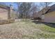 Spacious backyard featuring a wooden fence, lush grass, and a serene environment at 3109 Wynford Gables Sw, Marietta, GA 30064