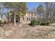 Traditional brick home featuring black shutters and a well-manicured lawn at 3109 Wynford Gables Sw, Marietta, GA 30064