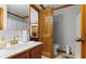 Classic bathroom showcasing a wooden door, a sink with a vanity, and a toilet next to the shower at 349 Asa Moseley Rd, Stockbridge, GA 30281
