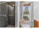 Cozy bathroom featuring glass shower, natural light and modern design at 349 Asa Moseley Rd, Stockbridge, GA 30281