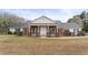 Charming single story home with a brick facade, white siding, and a welcoming front porch at 349 Asa Moseley Rd, Stockbridge, GA 30281