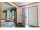 Spacious foyer featuring a tiled floor and a beautiful wooden door leading to the outside at 349 Asa Moseley Rd, Stockbridge, GA 30281