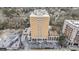 Aerial view of building with parking, landscaping, and commercial buildings nearby at 2285 Peachtree Ne Rd # 1107, Atlanta, GA 30309