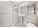 Bright and clean bathroom featuring a glass enclosed shower and a pedestal sink at 2285 Peachtree Ne Rd # 1107, Atlanta, GA 30309