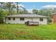 Spacious backyard featuring a small deck area and lush green grass at 2549 Fontaine Cir, Decatur, GA 30032