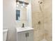 Updated bathroom featuring tile shower, modern vanity, and updated fixtures at 2549 Fontaine Cir, Decatur, GA 30032