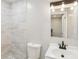 Modern bathroom featuring tiled shower, vanity, sink and stylish lighting at 2549 Fontaine Cir, Decatur, GA 30032