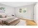 Bright bedroom with a comfortable bed, hardwood floors, and natural light at 2549 Fontaine Cir, Decatur, GA 30032