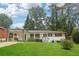 Charming single-story home featuring a well-maintained front lawn and covered porch at 2549 Fontaine Cir, Decatur, GA 30032