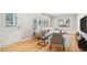 Bright living room featuring a large window, hardwood floors and comfortable neutral toned furniture at 2549 Fontaine Cir, Decatur, GA 30032