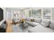 Bright living room featuring a large window, hardwood floors and comfortable neutral toned furniture at 2549 Fontaine Cir, Decatur, GA 30032