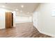Large finished basement with wood-look floors and a large storage closet at 4421 Paradise Cir, Vinings, GA 30339