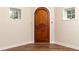 Basement doorway with wood-look floors flanked by bright, white walls at 4421 Paradise Cir, Vinings, GA 30339