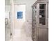 Bathroom featuring glass shower, tile floor, and linen cabinet with shelves and drawers at 4421 Paradise Cir, Vinings, GA 30339
