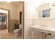 Elegant bathroom featuring a classic pedestal sink and tiled floors at 4421 Paradise Cir, Vinings, GA 30339