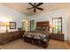 Comfortable bedroom with rustic wood accents and coordinated decor and a ceiling fan at 4421 Paradise Cir, Vinings, GA 30339