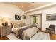 A traditionally decorated bedroom with white walls, wood ceiling, and light colored furniture at 4421 Paradise Cir, Vinings, GA 30339