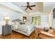 Bright bedroom with built-in shelving, a window seat, and hardwood flooring at 4421 Paradise Cir, Vinings, GA 30339