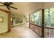 Spacious covered patio with ceiling fans and a view of the trees at 4421 Paradise Cir, Vinings, GA 30339