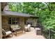 Spacious deck with ample seating offers a great spot to relax and enjoy the wooded views at 4421 Paradise Cir, Vinings, GA 30339