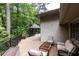 Expansive wooden deck provides plenty of room to relax with views of a gazebo and the wooded landscape at 4421 Paradise Cir, Vinings, GA 30339