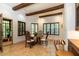 A dining area features a round table, wooden chairs, and dark shuttered windows at 4421 Paradise Cir, Vinings, GA 30339