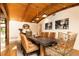 Elegant dining room featuring a long table, unique chairs, and wood ceiling at 4421 Paradise Cir, Vinings, GA 30339