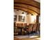 Elegant dining room with wood beams, modern chandelier and seating for ten at 4421 Paradise Cir, Vinings, GA 30339