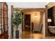 Elegant entryway with hardwood floors, wooden beams, and a decorative hanging light fixture at 4421 Paradise Cir, Vinings, GA 30339