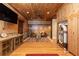 Large game room with hardwood floors, wood paneling, and a vintage jukebox at 4421 Paradise Cir, Vinings, GA 30339
