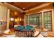 Attractive game room with rich wood accents, coffered ceilings, and an eye-catching game table at 4421 Paradise Cir, Vinings, GA 30339