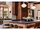 Well-designed kitchen featuring custom cabinetry, a farmhouse sink, and an island with a stone countertop at 4421 Paradise Cir, Vinings, GA 30339