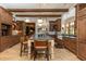 Expansive kitchen featuring a large center island with seating, custom cabinets, and modern appliances at 4421 Paradise Cir, Vinings, GA 30339