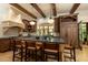 Gourmet kitchen with a large center island, custom range hood, and built-in refrigerator at 4421 Paradise Cir, Vinings, GA 30339