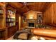 Inviting living room with wood paneling, built-in bookshelves, and a stone fireplace at 4421 Paradise Cir, Vinings, GA 30339
