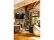 Comfortable living room showcasing a stone fireplace, stylish seating, and ample natural light at 4421 Paradise Cir, Vinings, GA 30339