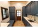 A mud room features dark blue cabinets and trim and light counter tops at 4421 Paradise Cir, Vinings, GA 30339