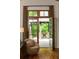 Inviting outdoor space with wooden doors opening to a deck and landscaped views at 4421 Paradise Cir, Vinings, GA 30339