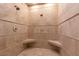 Close up of a large tile shower showcasing the dual shower heads and built in seating at 4421 Paradise Cir, Vinings, GA 30339