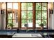 The kitchen sink has natural light through the window, and it is decorated with plants and lamps at 4421 Paradise Cir, Vinings, GA 30339