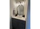 Chic bathroom with a gray vanity, marble countertop, and modern lighting fixtures at 5674 Kingsport Dr # 4, Atlanta, GA 30342