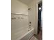 Bright bathroom showcasing a bathtub and tiled shower with shampoo niche, perfect for relaxation at 5674 Kingsport Dr # 4, Atlanta, GA 30342