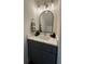 Stylish powder room with marble counter tops and modern fixtures at 5674 Kingsport Dr # 4, Atlanta, GA 30342