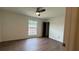 Spacious bedroom with a ceiling fan and natural light at 5674 Kingsport Dr # 4, Atlanta, GA 30342