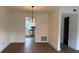 Bright dining area with wood floors and a view of the modern kitchen at 5674 Kingsport Dr # 4, Atlanta, GA 30342